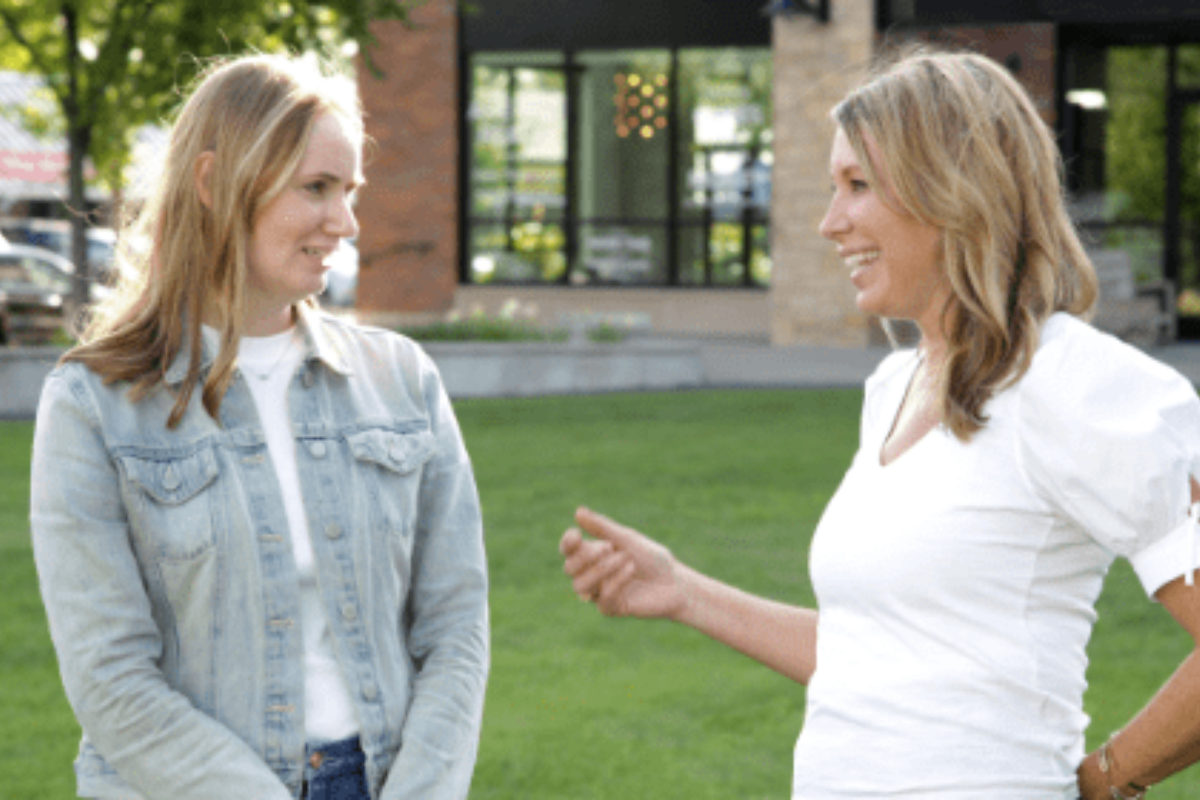 Two women standing outside talking