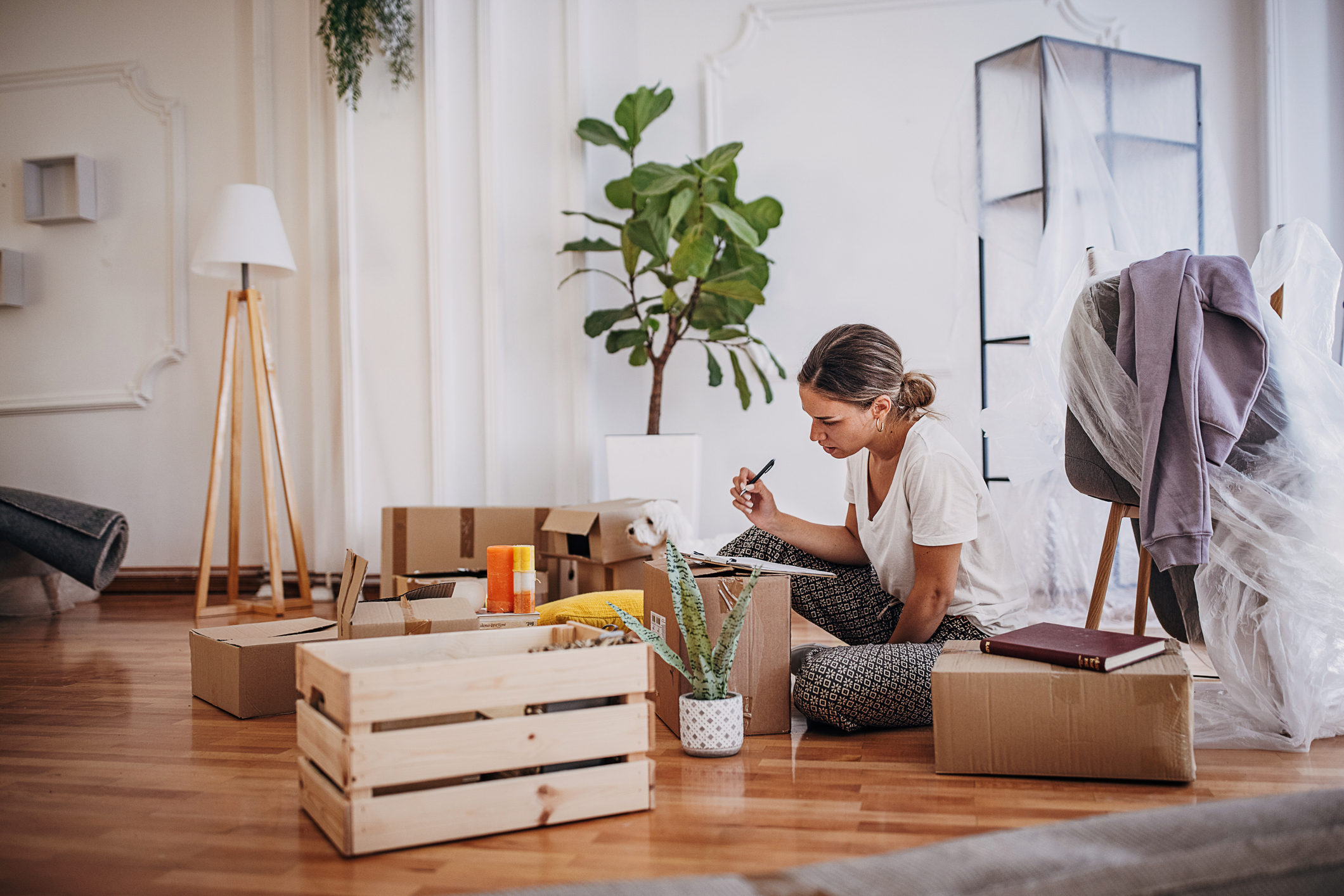 widow packing boxes to downsize her home