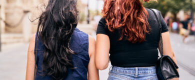 2 girls walking together outside